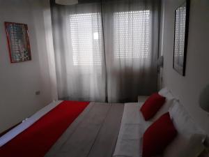 Postel nebo postele na pokoji v ubytování Hotel Migani