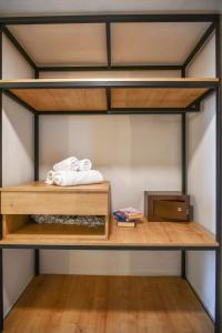 a bunk bed with two towels and a microwave at Despo Hotel in Gouves