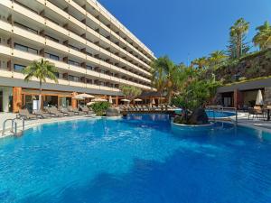 a large swimming pool in front of a hotel at FERGUS Puerto de la Cruz in Puerto de la Cruz