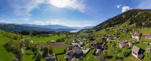 an aerial view of a village in the mountains at Hotel-Café-Restaurant Matzelsdorfer Hof in Millstatt