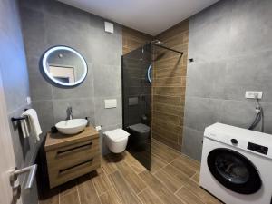 a bathroom with a sink and a toilet and a shower at Holiday Home Vrkic with Hot Tub in Omiš +43 photos
