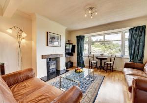 a living room with a couch and a table at Fairview in Dartmouth