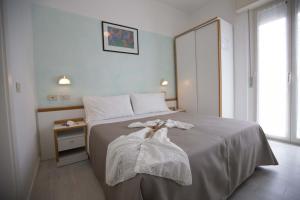 Postel nebo postele na pokoji v ubytování Hotel Eden B&B
