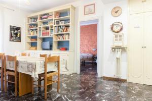 a dining room with a table and chairs at Re Lear - 4 bedrooms Apartment in Verona