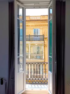 an open window with a view of a building at Hotel El Siglo in Valencia