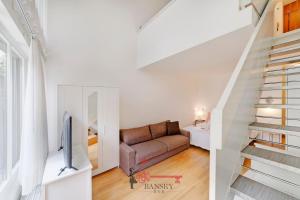 a living room with a couch and a staircase at Lugano Center - Apartment for 6 PEOPLE with TERRACE in Lugano