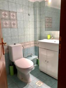 a bathroom with a toilet and a sink at Mina Apartments 4 Nea Kallikrateia in Nea Kalikratia