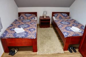 Postel nebo postele na pokoji v ubytování Apartman Tune