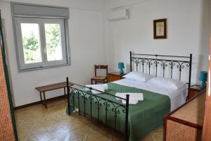 Casa Vacanze Marco Polo tesisinde bir odada yatak veya yataklar