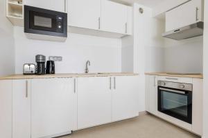 Kuchyň nebo kuchyňský kout v ubytování Serene apartment 6P 2BR - Puteaux La Défense + 9 fotografií