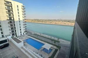 a view of a body of water from a building at The Sea World Lookout Loft in Abu Dhabi