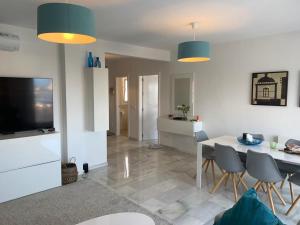 a kitchen and dining room with a table and chairs at Villa Calahonda - Mijas in Mijas