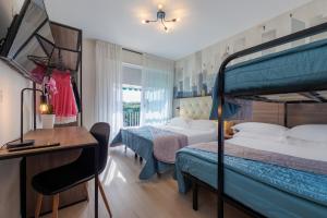 Postel nebo postele na pokoji v ubytování Hotel Picobello Pineta + 37 fotografií