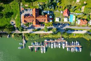 an aerial view of a marina with boats in the water at Amax Boutique Hotel in Mikołajki