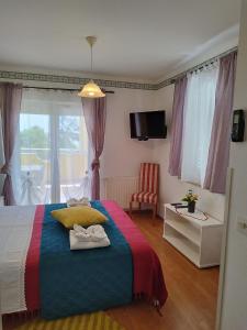 Postel nebo postele na pokoji v ubytování Apartments and Rooms PUNTA