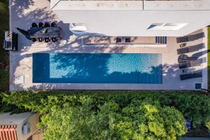 an overhead view of a swimming pool in a building at Villa Aida - 4 bedroom luxury villa with large private pool 4K projector and Jacuzzi in Pula