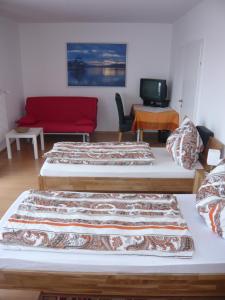 Łóżko lub łóżka w pokoju w obiekcie Paul's Home