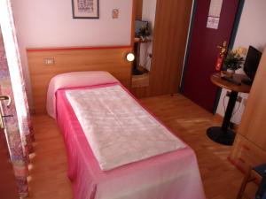 Postel nebo postele na pokoji v ubytování Hotel Rialto