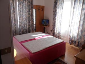 Postel nebo postele na pokoji v ubytování Hotel Rialto