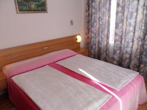 Postel nebo postele na pokoji v ubytování Hotel Rialto