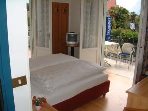 Postel nebo postele na pokoji v ubytování Hotel Rialto