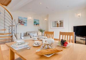 a dining room with a table with food on it at Florin in Seaton