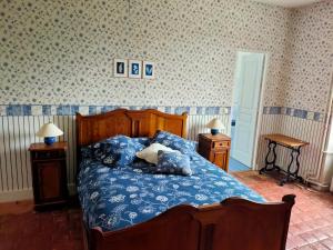 Postel nebo postele na pokoji v ubytování La ferme des douceurs