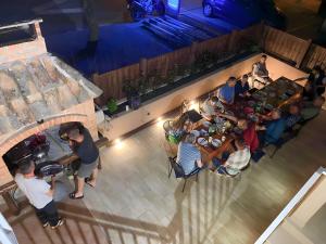 an overhead view of a restaurant with people sitting at tables at Apartments Katušić in Cavtat