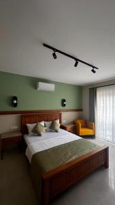 a bedroom with a large bed and a window at Mimoza Hotel in Oludeniz