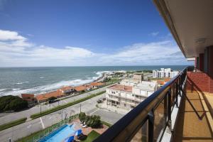 a balcony with a view of the ocean at Solanas Playa Mar del Plata in Mar del Plata
