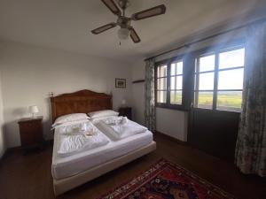 Postel nebo postele na pokoji v ubytování Agriturismo Scacciapensieri