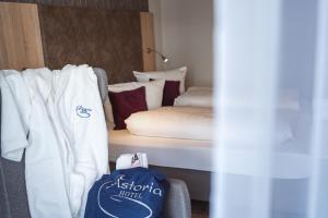 Postel nebo postele na pokoji v ubytování Hotel Astoria - Alexandra Krämer eK
