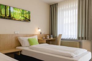 Postel nebo postele na pokoji v ubytování AKZENT Hotel Meerfräulein + 37 fotografií