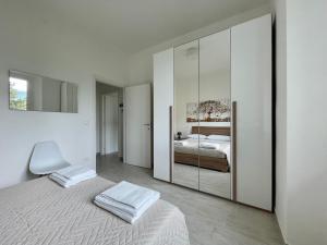 a bedroom with a bed and a large mirror at Dama Dama in Guardiagrele