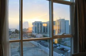 a view of a city from an open window at HAWADA PIONEER in Jeddah