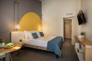 Postel nebo postele na pokoji v ubytování Sunny Dubrovnik by Valamar