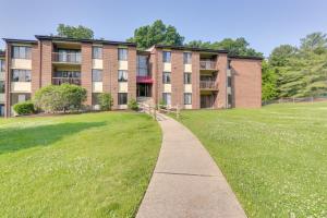 a walkway in front of an apartment building at Cozy Laurel Condo with Pool Access, about 20 Mi to DC! in Laurel