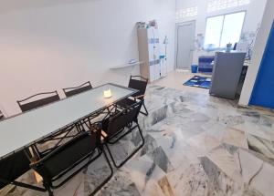 a meeting room with a long table and chairs at 611 Navy House Seremban Homestay Seremban Town in Seremban