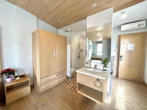 a large bathroom with a sink and a mirror at Zen Apartment in Ho Chi Minh City