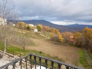 a view of a field from the balcony of a house at Casa Vacanza Contado Latino in Belmonte del Sannio