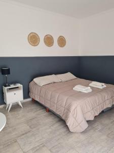 Ένα ή περισσότερα κρεβάτια σε δωμάτιο στο SUITE BELGRANO. ALQUILER TEMPORARIO EN SAN FRANCISCO