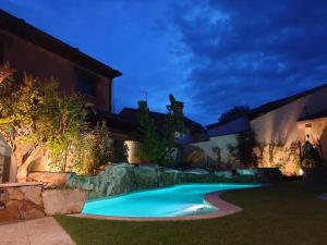 a swimming pool in the yard of a house at La Casa del Solaz in Anaya