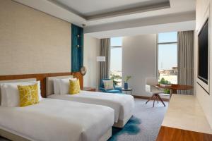 Vuode tai vuoteita majoituspaikassa Abesq Doha Hotel and Residences, an IHG Hotel