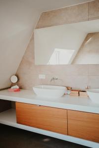 a bathroom with two sinks on a counter at Luxurious 4BR Villa's In Knokke in Knokke-Heist