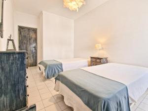 En eller flere senge i et værelse på Jcmar Apartments - 100 m from the beach - free wifi - by bedzy