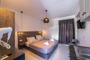 A bed or beds in a room at Katerina View