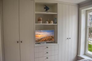 TV a/nebo společenská místnost v ubytování Strand und Meer