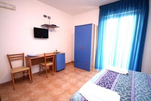 Rúm í herbergi á Hotel Alguer