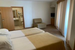 Кровать или кровати в номере Hotel Mare