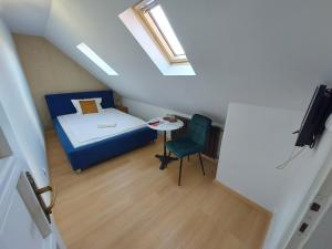 A bed or beds in a room at Palma Vendégház